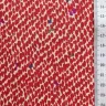 Tissu blanc à "tâches" rouges et quelques tâches bleues, vertes et marron